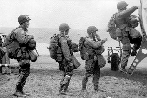 U.S. Army paratroopers load themselves into a transport plane prior to going into combat; June 1944..jpg