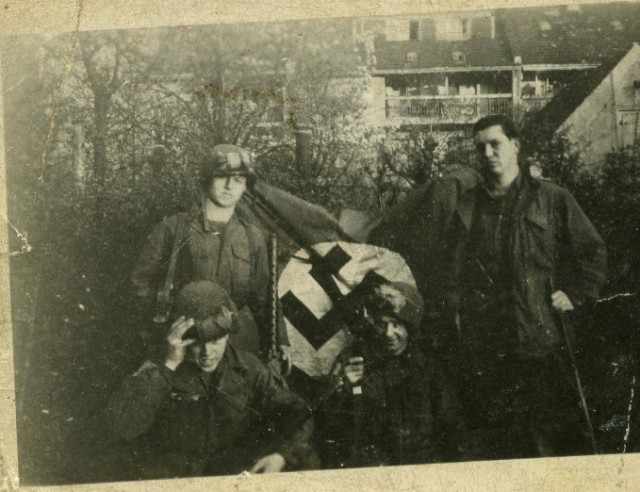 Paratroopers show off their captured German flag..jpg